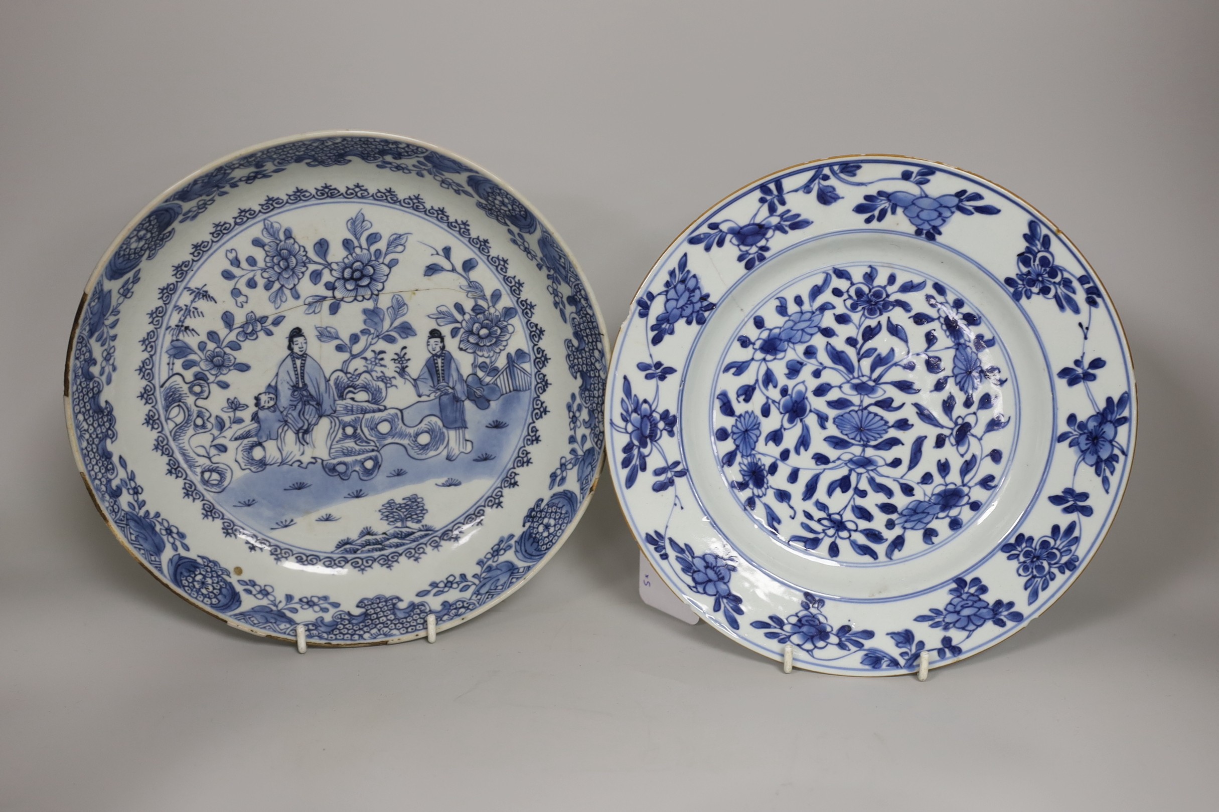 Three Chinese blue and white dishes and a bowl, together with an Imari vase. Largest 23cm diameter